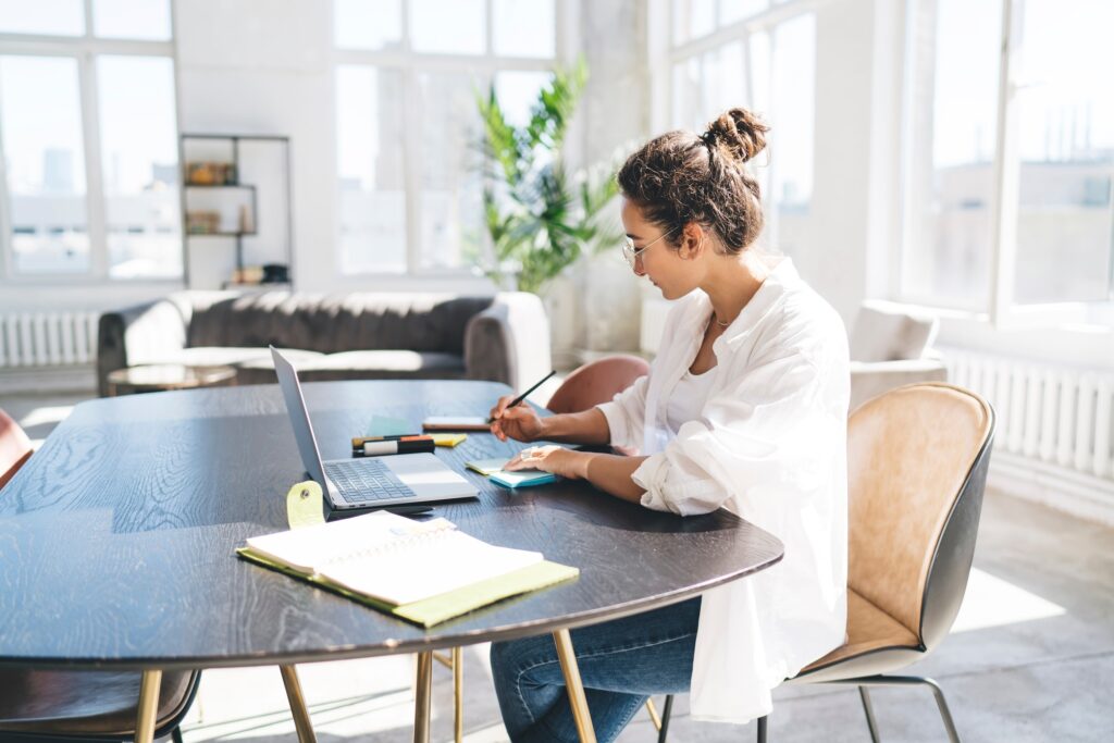 Self employed female working in living room